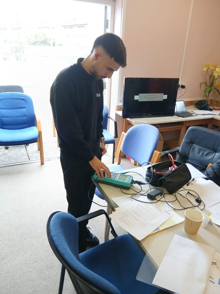 Learners getting hands-on with the PAT testing kit
